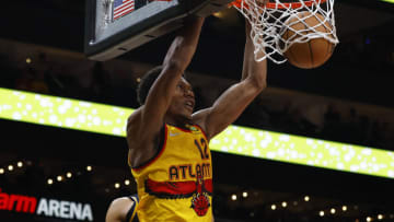 ATLANTA, GA - MARCH 25: De'Andre Hunter #12 of the Atlanta Hawks dunks during the second half against the Golden State Warriors at State Farm Arena on March 25, 2022 in Atlanta, Georgia. NOTE TO USER: User expressly acknowledges and agrees that, by downloading and or using this photograph, User is consenting to the terms and conditions of the Getty Images License Agreement. (Photo by Todd Kirkland/Getty Images)