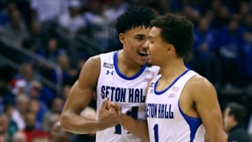 NEWARK, NJ - DECEMBER 12: Jared Rhoden #14 and Bryce Aiken #1 of the Seton Hall Pirates in action against the Rutgers Scarlet Knights during a game at Prudential Center on December 12, 2021 in Newark, New Jersey. Seton Hall defeated Rutgers 77-63. (Photo by Rich Schultz/Getty Images)