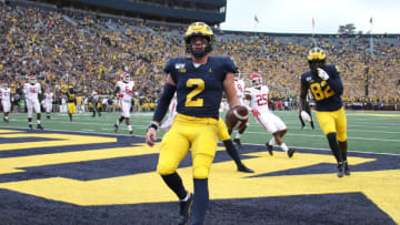 ANN ARBOR, MICHIGAN - SEPTEMBER 28: Shea Patterson #2 of the Michigan Wolverines scores a first quarter touchdown while playing the Rutgers Scarlet Knights at Michigan Stadium on September 28, 2019 in Ann Arbor, Michigan. (Photo by Gregory Shamus/Getty Images)