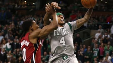 Apr 13, 2016; Boston, MA, USA; Boston Celtics guard Isaiah Thomas (4) is fouled by Miami Heat guard Josh Richardson (0) during the second half at TD Garden. Mandatory Credit: Mark L. Baer-USA TODAY Sports