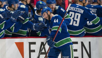 Nov 19, 2021; Vancouver, British Columbia, CAN; Vancouver Canucks defenseman Kyle Burroughs (44) celebrates his first NHL goal against the Winnipeg Jets in the second period at Rogers Arena. Mandatory Credit: Bob Frid-USA TODAY Sports