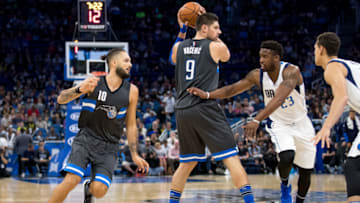 ORLANDO, FL - NOVEMBER 19: Wesley Matthews #23 of the Dallas Mavericks guards Nikola Vucevic #9 and Evan Fournier #10 of the Orlando Magic at Amway Center on November 19, 2016 in Orlando, Florida. NOTE TO USER: User expressly acknowledges and agrees that, by downloading and or using this photograph, User is consenting to the terms and conditions of the Getty Images License Agreement. (Photo by Manuela Davies/Getty Images)