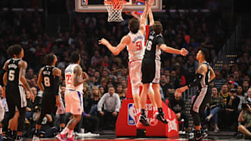 LOS ANGELES, CA - APRIL 03: Los Angeles Clippers Center Boban Marjanovic (51) is fouled by San Antonio Spurs Center Pau Gasol (16) during an NBA game between the San Antonio Spurs and the Los Angeles Clippers on April 3, 2018 at STAPLES Center in Los Angeles, CA. (Photo by Brian Rothmuller/Icon Sportswire via Getty Images)