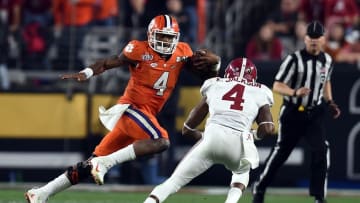 Jan 11, 2016; Glendale, AZ, USA; Clemson Tigers quarterback Deshaun Watson (4) runs the ball against Alabama Crimson Tide defensive back Eddie Jackson (4) during the third quarter in the 2016 CFP National Championship at University of Phoenix Stadium. Mandatory Credit: Joe Camporeale-USA TODAY Sports