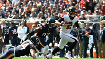 CHICAGO, IL - SEPTEMBER 10: Quarterback Matt Ryan #2 of the Atlanta Falcons carries the football ahead of Willie Young #97 of the Chicago Bears in the second quarter at Soldier Field on September 10, 2017 in Chicago, Illinois. (Photo by David Banks/Getty Images)