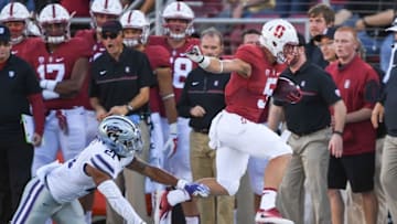 September 2, 2016; Stanford, CA, USA; Stanford Cardinal running back Christian McCaffrey (5) runs with the football past Kansas State Wildcats defensive back Kendall Adams (21) during the first quarter at Stanford Stadium. Mandatory Credit: Kyle Terada-USA TODAY Sports