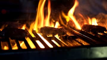 NEW YORK, NY - OCTOBER 16: Burgers cook on a grill during the Blue Moon Burger Bash presented by Pat LaFrieda Meats hosted by Rachael Ray - Food Network & Cooking Channel New York City Wine & Food Festival presented by FOOD & WINE at Pier 92 on October 16, 2015 in New York City. (Photo by Neilson Barnard/Getty Images for NYCWFF)