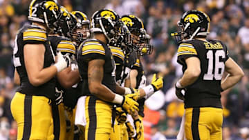 Dec 5, 2015; Indianapolis, IN, USA; Iowa Hawkeyes quarterback C.J. Beathard (16) leads his team in a huddle against the Michigan State Spartans in the Big Ten Conference football championship game at Lucas Oil Stadium. Mandatory Credit: Aaron Doster-USA TODAY Sports