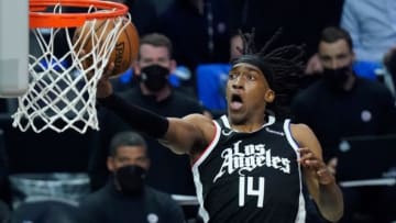 Jun 18, 2021; Los Angeles, California, USA; LA Clippers guard Terance Mann (14) scores on a breakaway during the third quarter of game six in the second round of the 2021 NBA Playoffs against the Utah Jazz at Staples Center. Mandatory Credit: Robert Hanashiro-USA TODAY Sports