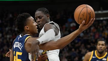 SALT LAKE CITY, UT - JANUARY 03: Donovan Mitchell #45 of the Utah Jazz shoots around the defense of Jrue Holiday #11 of the New Orleans Pelicans during their game at Vivint Smart Home Arena on January 3, 2018 in Salt Lake City, Utah. (Photo by Gene Sweeney Jr./Getty Images)