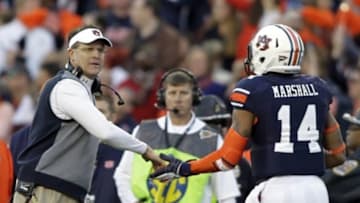 Nov 30, 2013; Auburn, AL, USA; Auburn Tigers head coach Gus Malzahn high fives quarterback Nick Marshall (14) during the second quarter at Jordan Hare Stadium. Mandatory Credit: John Reed-USA TODAY Sports