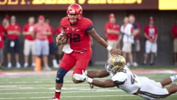 Sep 26, 2015; Tucson, AZ, USA; Arizona Wildcats quarterback Anu Solomon (12) runs the ball during the first quarter against the UCLA Bruins at Arizona Stadium. Mandatory Credit: Casey Sapio-USA TODAY Sports
