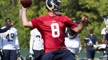 Jul 25, 2014; Earth City, MO, USA; St. Louis Rams quarterback Sam Bradford (8) attempts a pass during training camp at Rams Park. Mandatory Credit: Scott Rovak-USA TODAY Sports