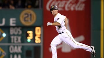 Jun 24, 2016; Pittsburgh, PA, USA; Pittsburgh Pirates infielder Adam Frazier (26) advances to second base on a wild pitch against the Los Angeles Dodgers during the sixth inning at PNC Park. Mandatory Credit: Charles LeClaire-USA TODAY Sports