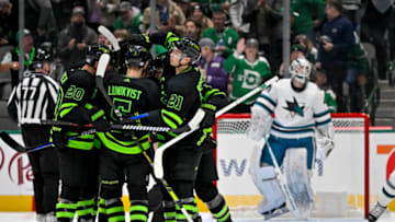 Nov 11, 2022; Dallas, Texas, USA; Dallas Stars defenseman Ryan Suter (20) and defenseman Nils Lundkvist (5) and left wing Jason Robertson (21) and center Roope Hintz (24) celebrates a goal scored by Hintz against the San Jose Sharks during the third period at American Airlines Center. Mandatory Credit: Jerome Miron-USA TODAY Sports