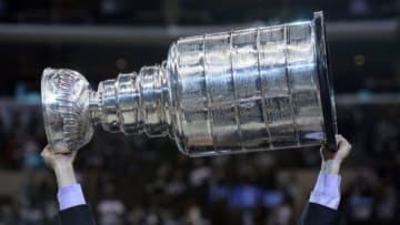 Jun 13, 2014; Los Angeles, CA, USA; The Stanley Cup is on the ice after the Los Angeles Kings defeated the New York Rangers in second overtime during game five of the 2014 Stanley Cup Final at Staples Center. Mandatory Credit: Gary Vasquez-USA TODAY Sports