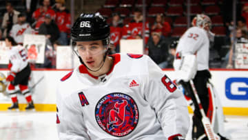 NEWARK, NEW JERSEY - MARCH 08: Jack Hughes #86 of the New Jersey Devils wears a jersey during warm-ups to celebrate Gender Equality Month prior to the game against the Colorado Avalanche at the Prudential Center on March 08, 2022 in Newark, New Jersey. (Photo by Bruce Bennett/Getty Images)