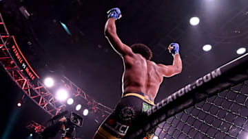 INGLEWOOD, CA - JULY 31: AJ McKee leaps on the cage as he celebrates after defeating Patricio Pitbull (not pitcured) by first round submission in their Featherweight World Title Main Event fight at The Forum on July 31, 2021 in Inglewood, California. (Photo by Jayne Kamin-Oncea/Getty Images)