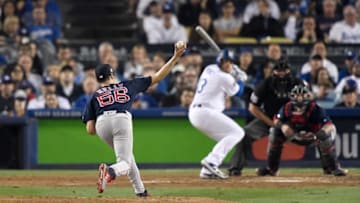 LOS ANGELES, CA - OCTOBER 26: Joe Kelly #56 of the Boston Red Sox delivers the pitch to Max Muncy #13 of the Los Angeles Dodgers during the sixth inning in Game Three of the 2018 World Series at Dodger Stadium on October 26, 2018 in Los Angeles, California. (Photo by Kevork Djansezian/Getty Images)