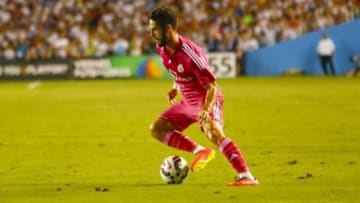 Jul 29, 2014; Dallas, TX, USA; Real Madrid forward Isco (23)dribbles during the game against AS Roma at Cotton Bowl Stadium. Mandatory Credit: Kevin Jairaj-USA TODAY Sports