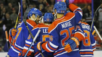 Feb 20, 2016; Edmonton, Alberta, CAN; The Edmonton Oilers celebrate a third period goal by forward Benoit Pouliot (67) against the Colorado Avalanche at Rexall Place. Mandatory Credit: Perry Nelson-USA TODAY Sports
