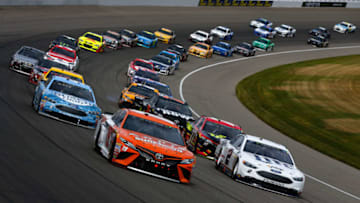 BROOKLYN, MI - AUGUST 13: Daniel Suarez, driver of the #19 ARRIS Surfboard/McAfee Toyota, leads the field in a restart during the Monster Energy NASCAR Cup Series Pure Michigan 400 at Michigan International Speedway on August 13, 2017 in Brooklyn, Michigan. (Photo by Sean Gardner/Getty Images)