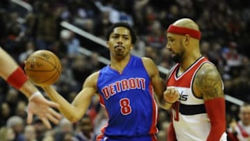 Feb 28, 2015; Washington, DC, USA; Detroit Pistons guard Spencer Dinwiddie (8) passes the ball as Washington Wizards forward Drew Gooden (90) defends during the first half at Verizon Center. The Wizards won 99 - 95. Mandatory Credit: Brad Mills-USA TODAY Sports