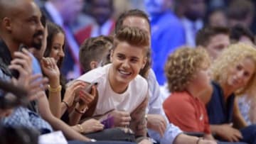 May 11, 2014; Los Angeles, CA, USA; Recording artist and entertainer Justin Bieber attends game four of the second round of the 2014 NBA Playoffs between the Oklahoma City Thunder and the Los Angeles Clippers at Staples Center. Mandatory Credit: Kirby Lee-USA TODAY Sports