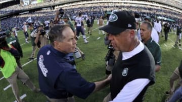 Oct 20, 2013; East Rutherford, NJ, USA; New York Jets head coach Rex Ryan (right) and New England Patriots head coach Bill Belichick shake hands after the game at MetLife Stadium. The Jets won the game 30-27 in overtime. Mandatory Credit: Joe Camporeale-USA TODAY Sports