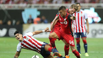 ZAPOPAN, MEXICO - APRIL 25: Alan Pulido of Chivas fights for the ball with Auro Junior of Toronto FC during the second leg match of the final between Chivas and Toronto FC as part of CONCACAF Champions League 2018 at Akron Stadium on April 25, 2018 in Zapopan, Mexico. (Photo by Refugio Ruiz/Getty Images)