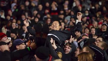 University of Cincinnati president Santa J. Ono crowd-surfs through the student section at Nippert Stadium during a UC Bearcats football game.