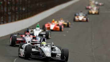 INDIANAPOLIS, IN - MAY 26: Tony Kanaan of Brazil, driver of the Hydroxycut KV Racing Technology-SH Racing Chevrolet, leads a pack of cars during the IZOD IndyCar Series 97th running of the Indianpolis 500 mile race at the Indianapolis Motor Speedway on May 26, 2013 in Indianapolis, Indiana. (Photo by Chris Graythen/Getty Images)