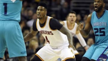 Jan 23, 2015; Cleveland, OH, USA; Cleveland Cavaliers guard Iman Shumpert (4) defends Charlotte Hornets guard Lance Stephenson (1) during the second half at Quicken Loans Arena. The Cavs won 129-90. Mandatory Credit: Ken Blaze-USA TODAY Sports