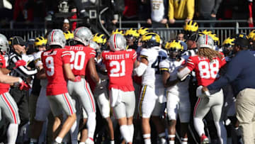 Michigan Wolverines football palyers and the Ohio State Buckeyes get into a shoving match on the sidelines during the second half Nov. 26, 2022 at Ohio Stadium in Columbus.michigan vs ohio state