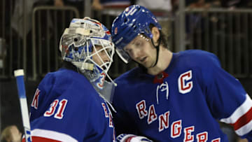 NEW YORK, NEW YORK - DECEMBER 22: Igor Shesterkin #31 and Jacob Trouba #8 of the New York Rangers celebrate their 5-3 victory over the New York Islanders at Madison Square Garden on December 22, 2022 in New York City. (Photo by Bruce Bennett/Getty Images)