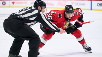 OTTAWA, ON - FEBRUARY 18: Colin White #36 of the Ottawa Senators prepares for a faceoff as lineman James Tobias #61 waist for the the Buffalo Sabres player at Canadian Tire Centre on February 18, 2020 in Ottawa, Ontario, Canada. (Photo by Jana Chytilova/Freestyle Photography/Getty Images)