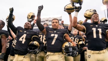 WEST POINT, NY - NOVEMBER 17: Cam Thomas #4, Jaylon McClinton #7, and Donavan Lynch #11 of the Army Black Knights sing the alma mater after winning a game against the Colgate Raiders at Michie Stadium on November 17, 2018 in West Point, New York. (Photo by Dustin Satloff/Getty Images)