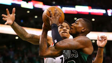 BOSTON, MA - MARCH 31: Terry Rozier #12 of the Boston Celtics is fouled by DeMar DeRozan #10 of the Toronto Raptors during a game at TD Garden on March 31, 2018 in Boston, Massachusetts. NOTE TO USER: User expressly acknowledges and agrees that, by downloading and or using this photograph, User is consenting to the terms and conditions of the Getty Images License Agreement. (Photo by Adam Glanzman/Getty Images)