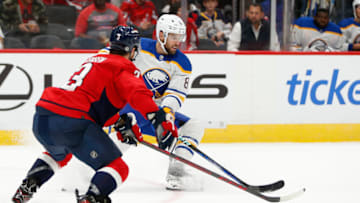 Sep 25, 2022; Washington, District of Columbia, USA; Buffalo Sabres center Riley Sheahan (8) controls the puck in front of Washington Capitals defenseman Nick Jensen (3) during the second period at Capital One Arena. Mandatory Credit: Amber Searls-USA TODAY Sports