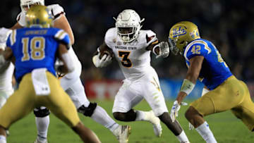 PASADENA, CA - NOVEMBER 11: Eno Benjamin #3 of the Arizona State Sun Devils runs past Kenny Young #42 and Octavius Spencer #18 of the UCLA Bruins during the first half of a game at the Rose Bowl on November 11, 2017 in Pasadena, California. (Photo by Sean M. Haffey/Getty Images)