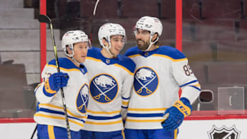 Jan 18, 2022; Ottawa, Ontario, CAN; Buffalo Sabres left wing Jeff Skinner (53-left) and right wing Alex Tuch (89-right) celebrate a goal scored by center Dylan Cozens (24-center) in the first period against the Ottawa Senators at the Canadian Tire Centre. Mandatory Credit: Marc DesRosiers-USA TODAY Sports