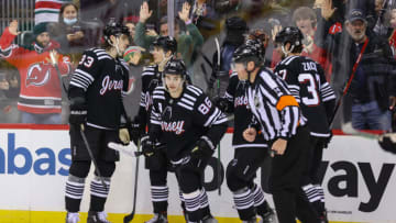 Feb 13, 2022; Newark, New Jersey, USA; The New Jersey Devils celebrate a goal by New Jersey Devils center Jack Hughes (86) against the Pittsburgh Penguins during the second period at Prudential Center. Mandatory Credit: Ed Mulholland-USA TODAY Sports