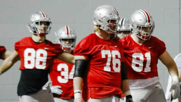 Harry Miller (76) arrived at Ohio State as a center before moving to guard to fill a vacancy this yearSecondary art