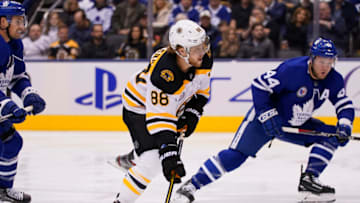 Nov 15, 2019; Toronto, Ontario, CAN; Boston Bruins forward David Pastrnak (88) goes to shoot the puck as Toronto Maple Leafs defenseman Morgan Rielly (44) defends during the first period at Scotiabank Arena. Mandatory Credit: John E. Sokolowski-USA TODAY Sports