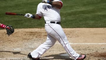 May 11, 2014; Arlington, TX, USA; Texas Rangers first baseman Prince Fielder (84) follows through for a single against the Boston Red Sox during the fourth inning of a baseball game at Globe Life Park in Arlington. Mandatory Credit: Jim Cowsert-USA TODAY Sports