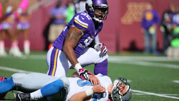 MINNEAPOLIS, MN - OCTOBER 12: Quarterback Matthew Stafford #9 of the Detroit Lions lays on the ground after being hit by Tom Johnson #92 of the Minnesota Vikings during the first quarter on October 12, 2014 at TCF Bank Stadium in Minneapolis, Minnesota. (Photo by Adam Bettcher/Getty Images)