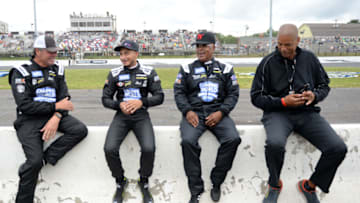 STAFFORD SPRINGS, CONNECTICUT - JUNE 12: (L-R) Michael Waltrip, Ernie Francis Jr., Willy T. Ribbs, and CBS host Brad Daugherty talk on the grid during practice for the Inaugural Superstar Racing Experience Event at Stafford Motor Speedway on June 12, 2021 in Stafford Springs, Connecticut. (Photo by Kathryn Riley/SRX via Getty Images)