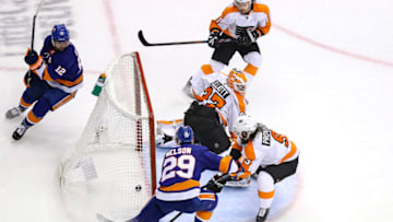 Brock Nelson, Josh Bailey, New York Islanders and Brian Elliott, Ivan Provorov, Philadelphia Flyers (Photo by Elsa/Getty Images)