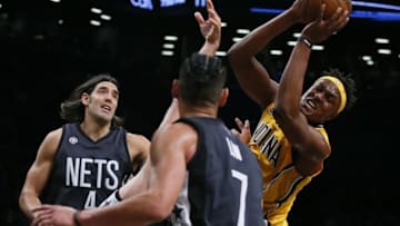 Oct 28, 2016; Brooklyn, NY, USA; Indiana Pacers forward Myles Turner (33) grabs a rebound against Brooklyn Nets guard Bojan Bogdanovic (44) during first half at Barclays Center. Mandatory Credit: Noah K. Murray-USA TODAY Sports