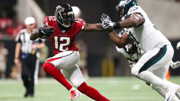 ATLANTA, GA - SEPTEMBER 15: Mohamed Sanu #12 of the Atlanta Falcons pushes off Fletcher Cox #91 of the Philadelphia Eagles during the second half of a game at Mercedes-Benz Stadium on September 15, 2019 in Atlanta, Georgia. (Photo by Carmen Mandato/Getty Images)